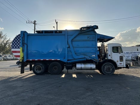 peterbilt-320-flatbed-dump-truck #1450796